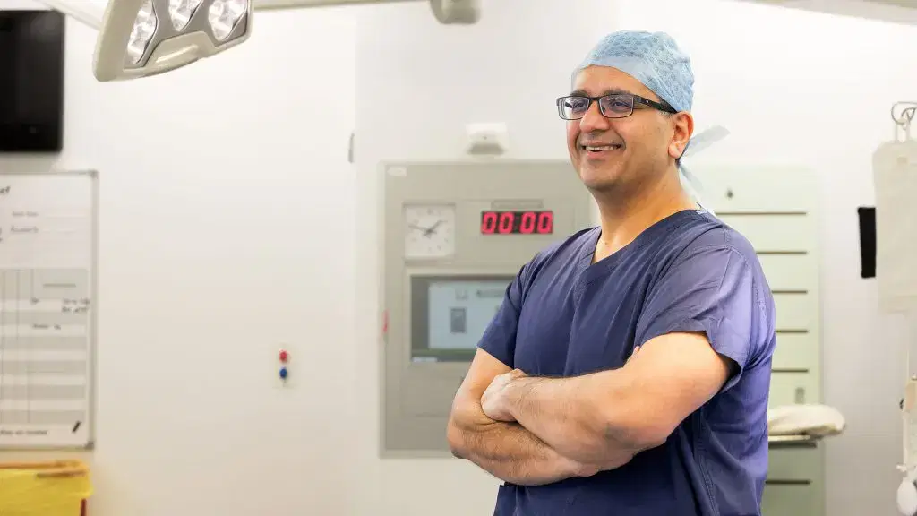 Smiling Mr Kumar in scrubs